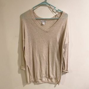 Cream sweater in size medium.